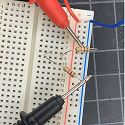 Detail shot of two 330 Ohm resistors on breadboard