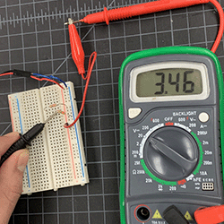 Voltage reading of 9v battery running through two 330 Ohm resistors