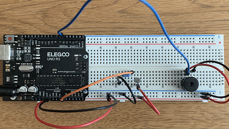 Photo of breadboard including photoresistor and the passive buzzer